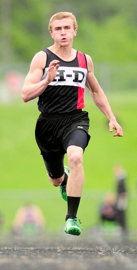 FOCUSED ON THE FINISH: Hall-Dale High School’s Tyler Fiztgerald runs in the 100-meter dash during the Mountain Valley Conference track and field meet Friday at Alumni Field in Augusta. Fitzgerald won in 11.37. He also won the 400 and was second in the 200.