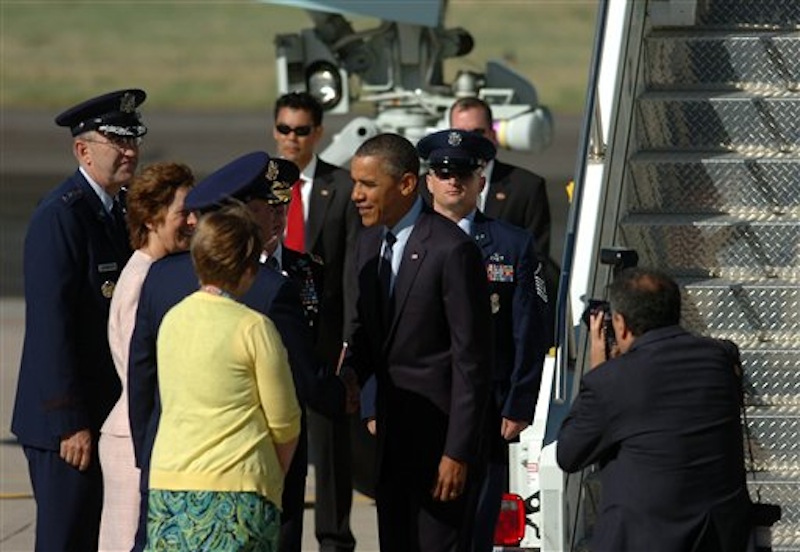 President Barack Obama greets dignitaries after he arrived on Air Force One at Peterson Air Force Base, Colo. on Wednesday, May 23, 2012. Obama will deliver the commencement speech to the Air Force Academy graduates. (AP Photo/Bryan Oller)