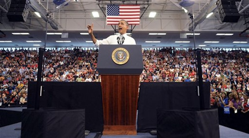 President Barack Obama waves as he delivers an address on the economy, jobs and taxes at Florida Atlantic University in Boca Raton, Fla., Tuesday, April 10, 2012. (AP Photo/South Florida Sun Sentinel, Mark Randall)
