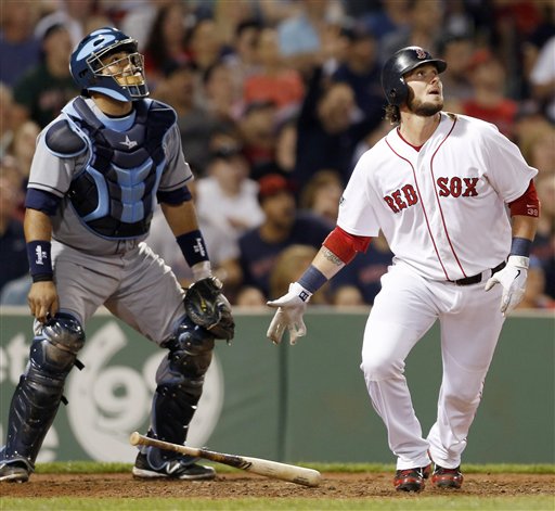 Boston Red Sox's Jarrod Saltalamacchia, right, watches his two-run home run to defeat the Tampa Bay Rays 3-2 in front of Rays catcher Jose Molina in the ninth inning of a baseball game in Boston, Saturday, May 26, 2012. (AP Photo/Michael Dwyer)