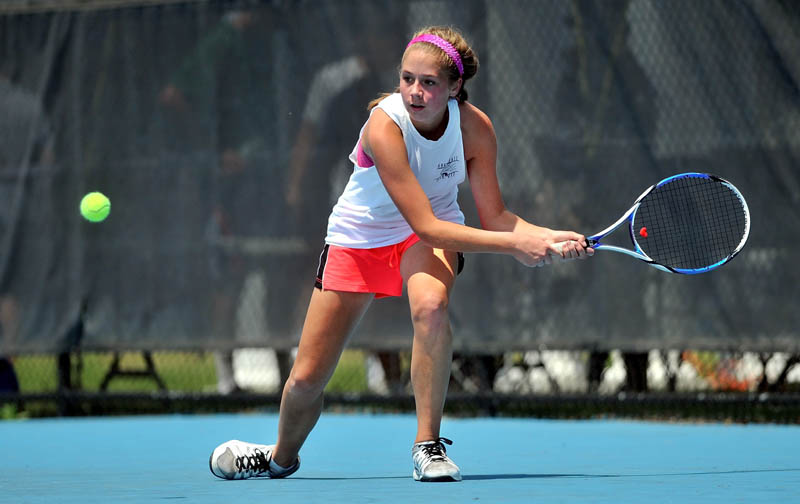 PLAYING TOUGH: Waterville Senior High School’s Colleen O’Donnell returns a shot to Brunswick High School’s Maisie Silverman in the quarterfinals at the tennis singles state tournament Saturday at Colby College in Waterville. O’Donnell lost 7-5, 6-1. For complete results, see c4.