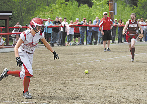 AND THE RACE IS ON: After putting down a bunt, Cony High School’s Alyssa Brochu races down the first base line to try and beat out a throw by Bangor High School’s Kamdra Prendergast, right, on Wednesday in Augusta.