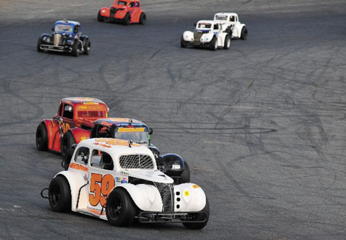 Gaining speed: Reid Lanpher, 14, of Manchester, drives the 59 car in a NELCAR Legends race last Sunday at Seekonk Speedway in Seekonk, Mass. Lanpher finished fourth. The teen driver will compete in the Legends series and the Granite State Pro Stock circuit this summer.