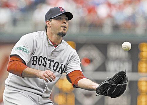 STAYING FOCUSED: Boston starting pitcher Josh Beckett fields a ball hit by Philadelphia’s Ty Wigginton during the seventh inning of an interleague game Sunday in Philadelphia. Beckett allowed one run on seven hits while striking out five and walking two in 72⁄3 innings.