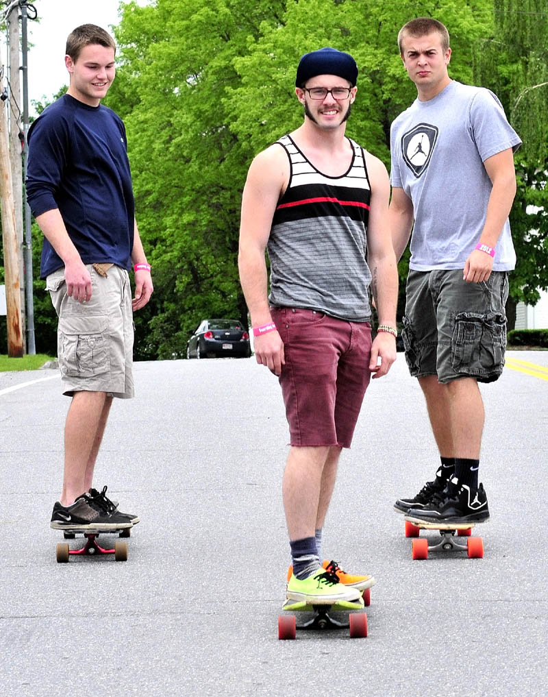 WINDING ROAD: These long board riders that took part in last years Boarding for Boobies campaign will again raise money for breast cancer research when they ride from Old Orchard Beach to New York City. Seen practicing in Skowhegan on Sunday are from left, Ethan Johnson, Connor Reeves and Jacob Weese.