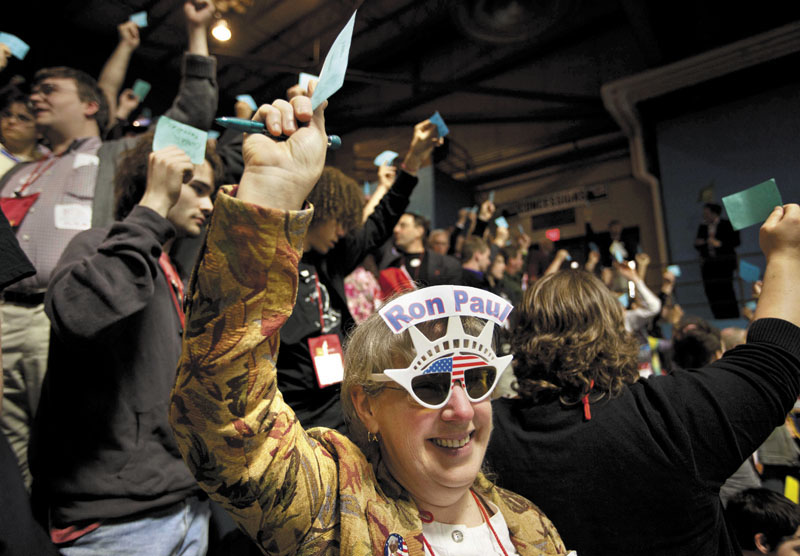 Linda Silvia, of China, and a delegate from Kennebec County, holds up a blue card Saturday while voting for Ron Morrell to be convention secretary during the Maine Republican Convention at the Augusta Civic Center.