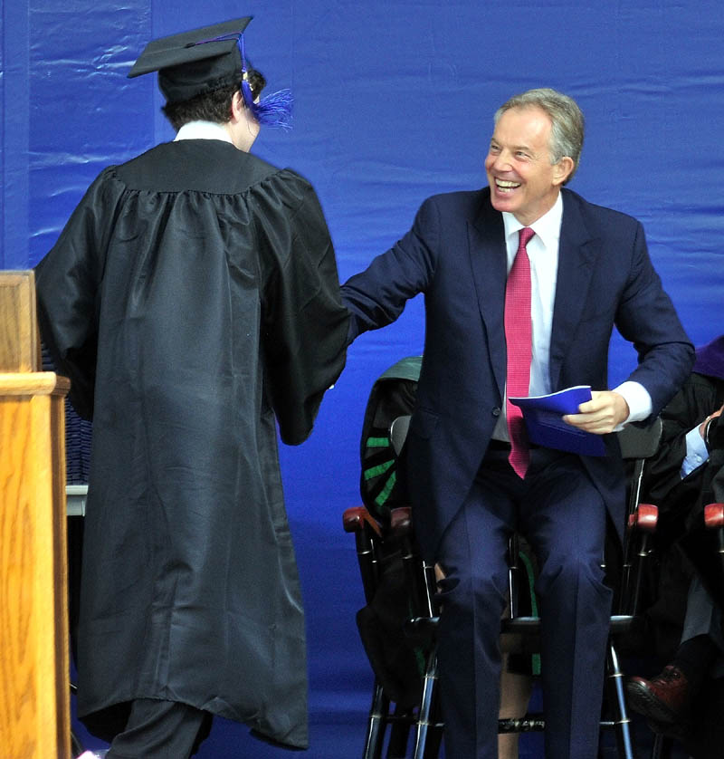 Colby College senior class speaker Samuel Deeran thanks commencement speaker and former Prime Minister of Britain Tony Blair in Waterville on Sunday.