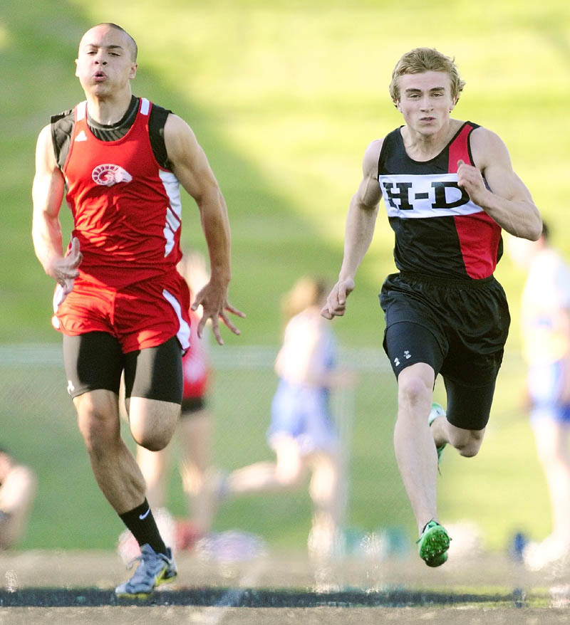 TO THE FINISH LINE: Cony’s Luke Dang, left, and Hall-Dale’s Tyler Fitzgerald compete in the 100-meter dash during a meet Friday evening at Alumni Field in Augusta.