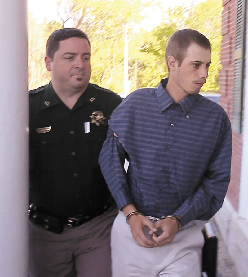 Gordon Collins-Faunce is led into York County Superior Court in Alfred on Friday. Collins-Faunce was charged with depraved indifference murder and is being held on $100,000 bail.
