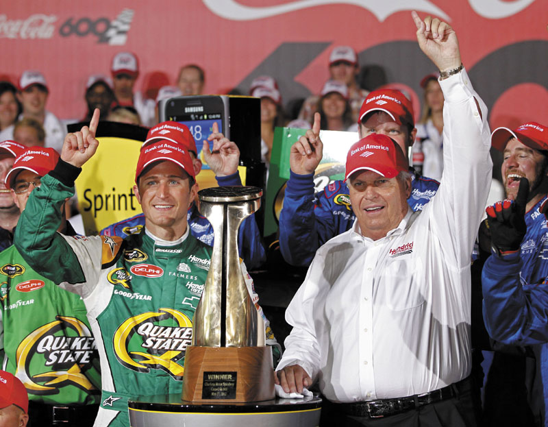 ON A ROLL: Kasey Kahne, left, and team owner Rick Hendrick, right, pose with the trophy in victory lane after Kahne won the Coca-Cola 600 on Sunday in Concord, N.C.