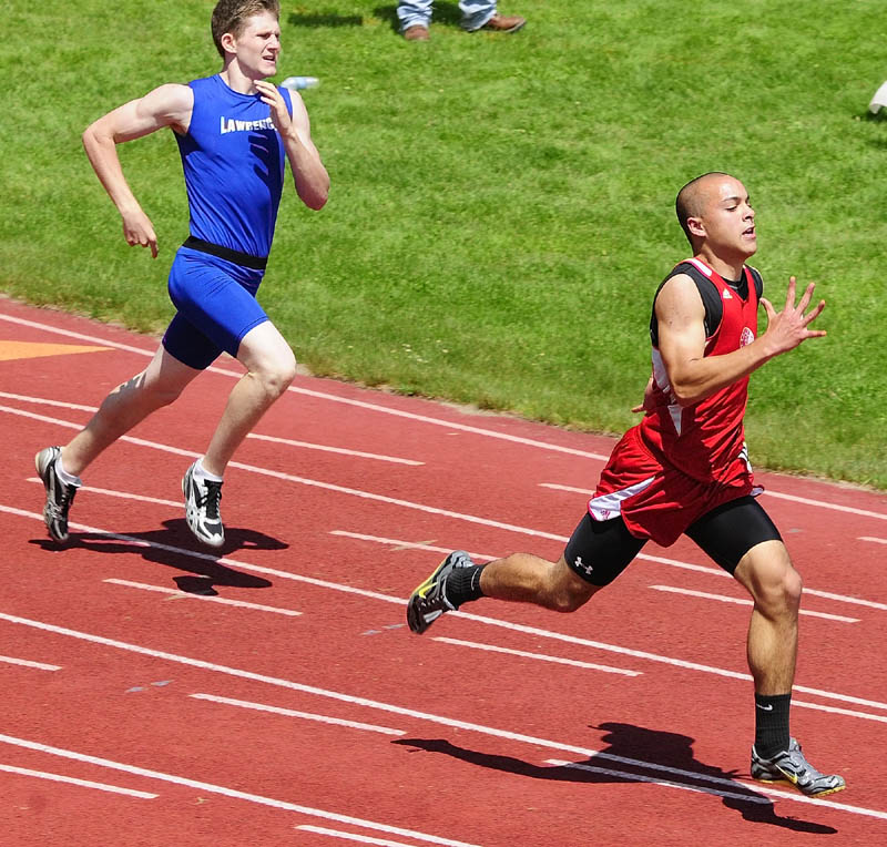 FOLLOW ME: Cony’s Luke Dang, right, leads Lawrence’s Timothy Dudley in the 400-meter run during the Kennebec Valley Athletic Conference championship track and field meet Saturday in Bath. Dang finished second in 51.50 behind Brunswick’s Alex Nicholas (49.91). Dudley was third in 51.75.
