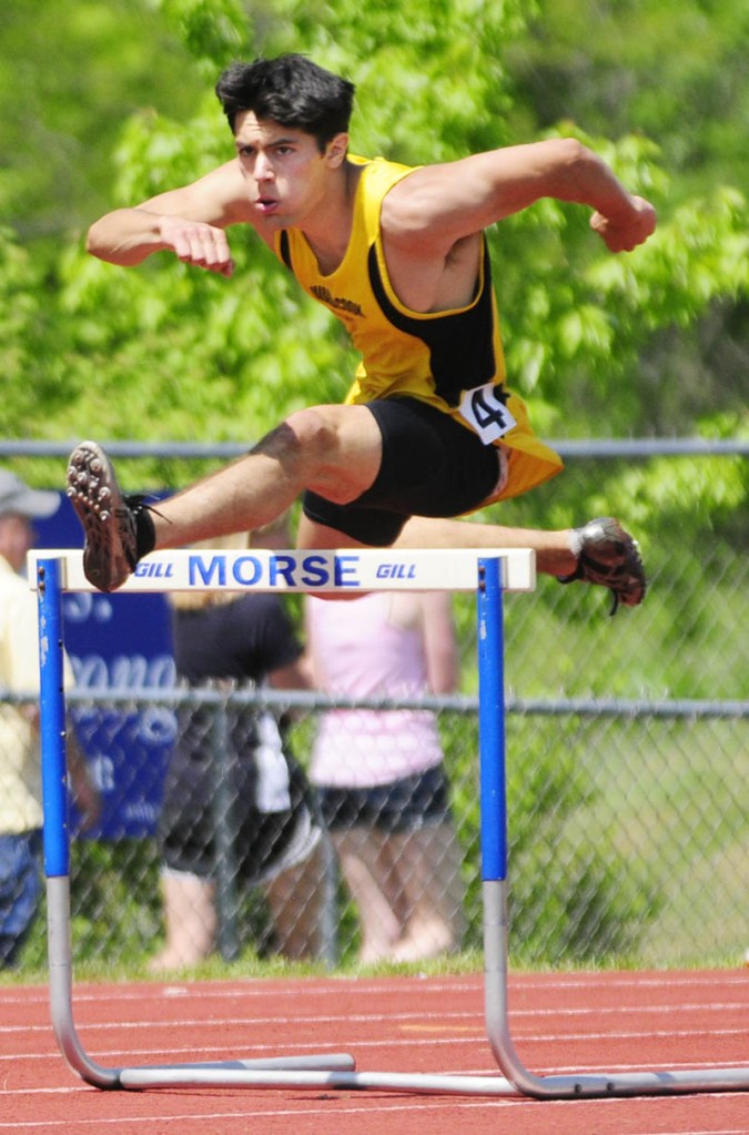 FOCUSED ON WINNING: Maranacook’s Taylor Watson runs the 300-meter hurdles during the Kennebec Valley Athletic Conference championship track and field meet Saturday in Bath. Watson won in 40.70 seconds. He also won the 110 hurdles in 15.35. For complete results, see C4.