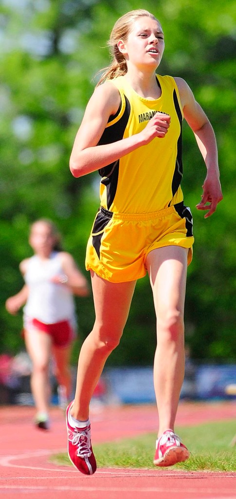 CONCENTRATION: Maranacook’s Abby Mace runs the 3200-meter race during the Kennebec Valley Athletic Conference championship track and field meet Saturday in Bath. Mace finished second in 11 minutes, 30.08 seconds behind Waterville’s Bethany Brown, who finished in 11:05.06. For complete results, see C4.
