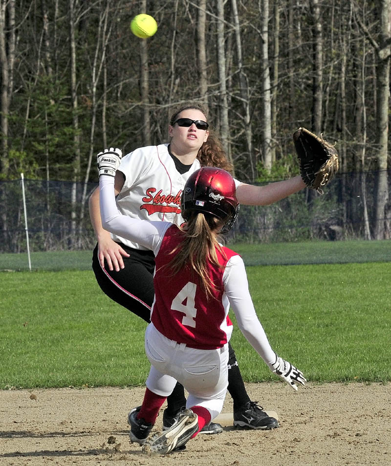 CLOSE PLAY: Skowhegan’s Kaitlyn Therriault fields a throw as Messalonskee’s Nikki Collier slides safely into second base during their game Monday in Oakland.