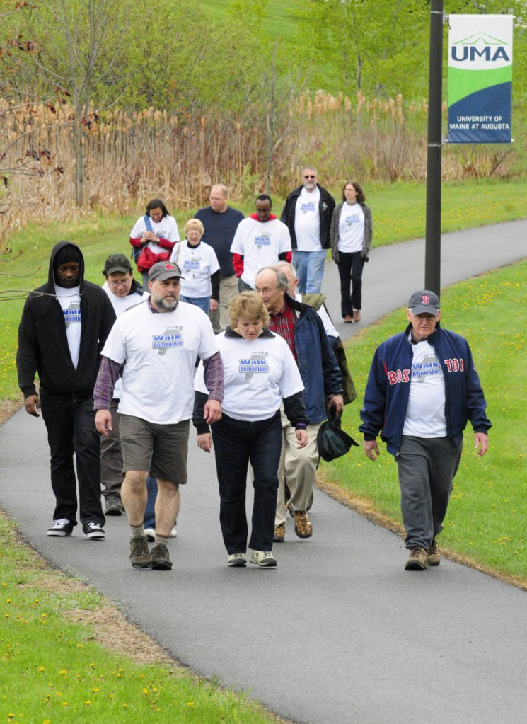 Fourteen people walked in Saturday's Walk to Remember event sponsored by the Holocaust & Human Rights Center. They went from the campus up and around the Civic Center parking and back to Center for a film and discussions.