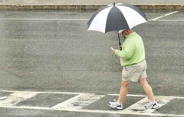A walker with an umbrella walks through Market Square on a rainy Tuesday afternoon in downtown Augusta. It would be a good idea to those umbrellas handy, since, the National Weather Service forecast calls for rain through Thursday evening.