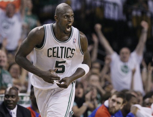 Boston Celtics forward Kevin Garnett screams after he scores during the fourth quarter of Game 7 against the Philadelphia 76ers on Saturday, May 26, 2012. Garnett has decided to return to the Celtics for three more seasons, according to published reports. (AP Photo/Elise Amendola)