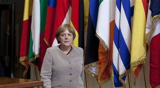 German Chancellor Angela Merkel leaves an EU Summit in Brussels on today. European leaders have agreed to use the continent's permanent bailout fund to recapitalize struggling banks, and agreed to the idea of a tighter union in the long term.