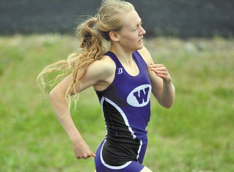 RECORD RUN: Waterville Senior High School’s Bethanie Brown runs in the 1,600-meter run at the Class B state championship meet Saturday at Mount Desert Island High School. Brown won the race in a state record time of 4 minutes, 55.23 seconds.