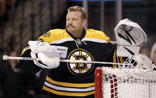 In this February 2012 photo, Boston Bruins goalie Tim Thomas gets ready for an NHL hockey game between the Bruins and the Pittsburgh Penguins in Boston. Thomas, who has emerged as one of the NHL's top goaltenders despite an unorthodox style in hockey and in life, has told the Bruins that he is thinking about sitting out next season--apparently for family reasons, general manager Peter Chiarelli said Friday, June 1, 2012. (AP Photo/Winslow Townson)
