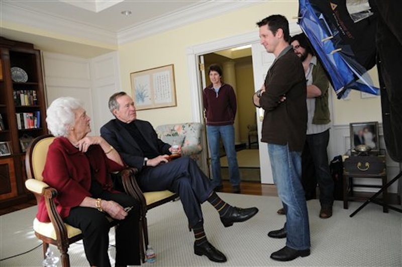 This image released by HBO shows former first lady Barbara Bush, from left, former President George H. W. Bush, Kris Conde, Stephen Glidden, Jeffrey Roth during the filming of "41," a documentary about Bush premiering Thursday, June 14, at 9:00 p.m. EST on HBO. (AP Photo/HBO, Brian Blake)