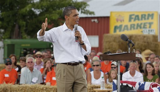 President Barack Obama speaks during a town hall meeting at Country Corner Farm Market in Alpha, Ill. He doesn't hesitate to remind people that his mother grew up in Kansas.