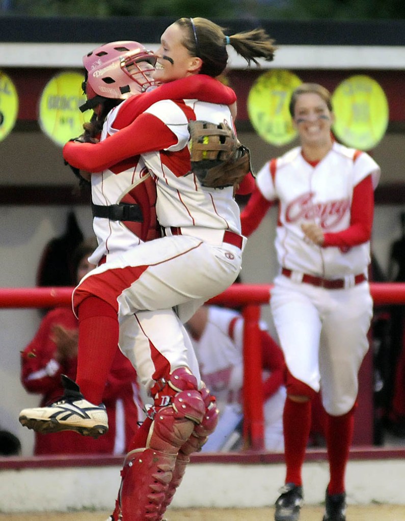 Cony High School pitcher Sonja Morse leaps into the arms of catcher Nicole Rugan after defeating Brewer High School for the Eastern Maine Class A softball championship game Tuesday in Augusta. Cony won 1-0.