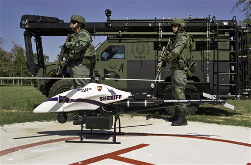 This September 2011 photo provided by Vanguard Defense Industries shows a ShadowHawk drone with Montgomery County, Texas, SWAT team members.