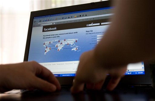 In this Thursday, July 16, 2009, file photo, a Facebook user logs into their account in Ottawa, Ontario, Canada. In yet another change that irked users, Facebook has replaced the email address you picked to display on your profile page when you signed up for the online social network with an (at)facebook.com address. Previously, users may have had a yahoo.com or gmail.com address displayed, so that if people wanted to contact them outside of Facebook, they could. Sending an email to a Facebook.com address will land the email in the messages section of your Facebook profile. (AP Photo/The Canadian Press, Sean Kilpatrick) Canada;Canadian;Face;Book;Facebook