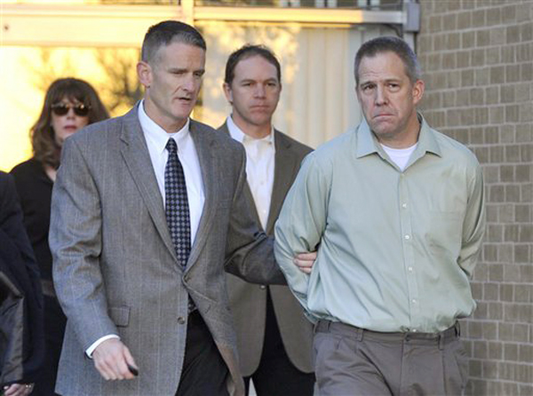 Frederick Osbon, right, is escorted by FBI agents as he is released from The Pavilion at Northwest Texas Hospital in Amarillo, Tex. in this April, 2, 2012, photo.