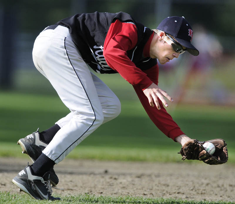 VERTICAL: Hall-Dale High School third baseman Kurt Thiele snags a grounder Wednesday during a match up against Wiscasset High School in Farmingdale.