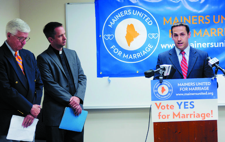 CHANGES: Matt McTighe, campaign manager for Mainers United for Marriage speaks during a press conference Wednesday, June 20, 2012. To the left is John Paterson, the president of the board of directors for the ACLU of Maine and former deputy Maine Attorney General and Michael Gray, center, the pastor of Old Orchard Beach United Methodist Church and the lead signer on the citizens initiative.