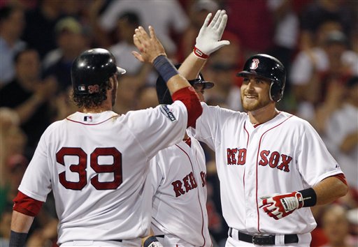 Boston Red Sox Will Middlebrooks, right, is congratulated by Jarrod Saltalamacchia (39) after his two-run home run against the Miami Marlins during the eighth inning of a baseball game at Fenway Park in Boston, Thursday, June 21, 2012. (AP Photo/Charles Krupa)