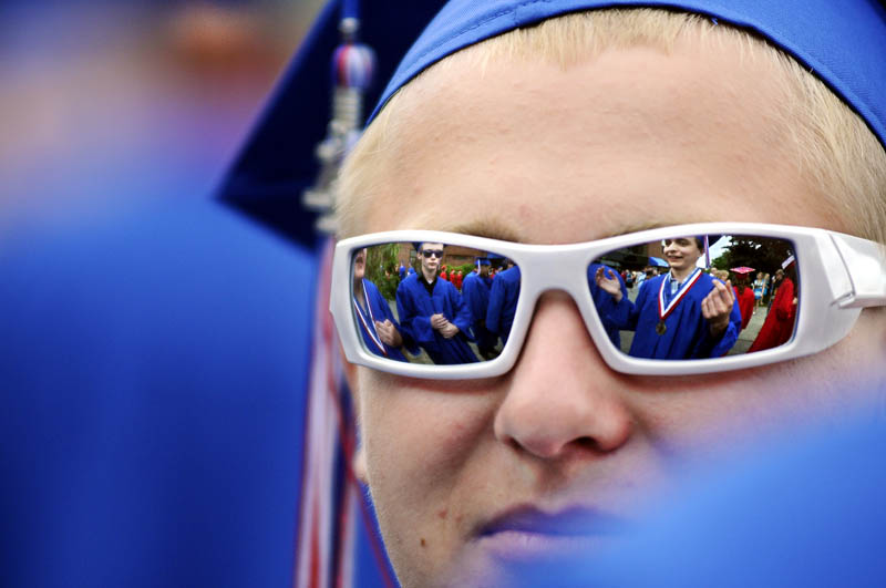 MOVING ON: Messalonskee High School senior Luke Principato, of Oakland, waits with classmates Thursday for graduation in Augusta to begin.