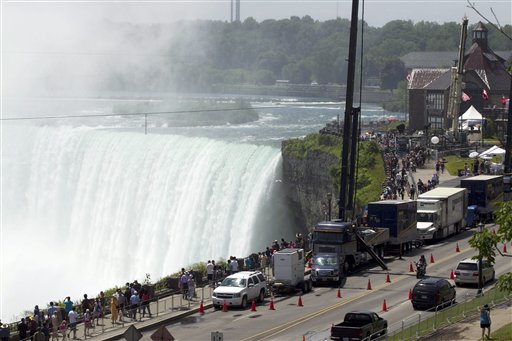 Spectators and media gather as the tightrope that Nik Wallenda will use stretches over Niagara Falls today. Conditions appear good leading up to the nationally televised stunt scheduled for tonight.