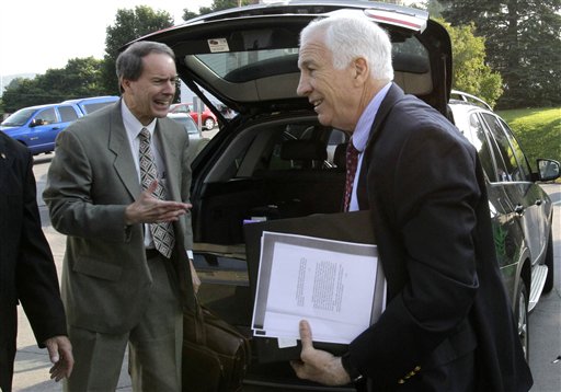 Former Penn State University assistant football coach Jerry Sandusky, right, arrives with his attorney Joe Amendola at the Centre County Courthouse in Bellefonte, Pa., today.