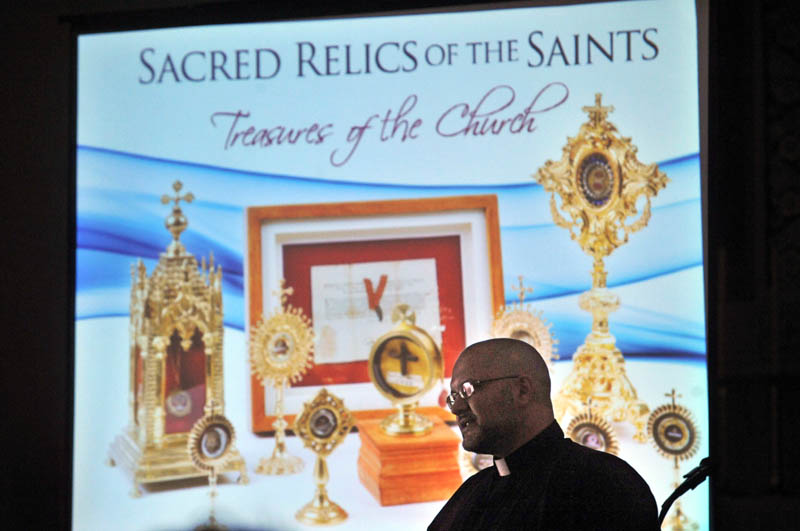 HISTORY COMES TO LIFE: The Rev. Carlos Martins brought a collection of relics to Saint Joseph’s Maronite Church in Waterville on Sunday.