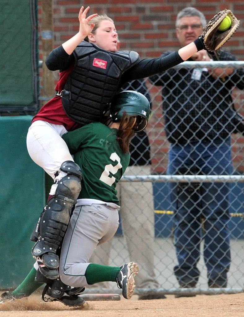 LOOK OUT: Richmond catcher Lindsy Hoopingarner, left, collides with Penobscot’s Alissa Whitten at home plate in the third inning of the Class D softball state championship Saturday in Brewer.