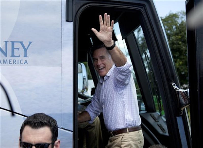 Republican presidential candidate, former Massachusetts Gov. Mitt Romney waves as he gets on his bus after a campaign stop at the Scamman Farm in Stratham, N.H., Friday, June 15, 2012. (AP Photo/Evan Vucci)