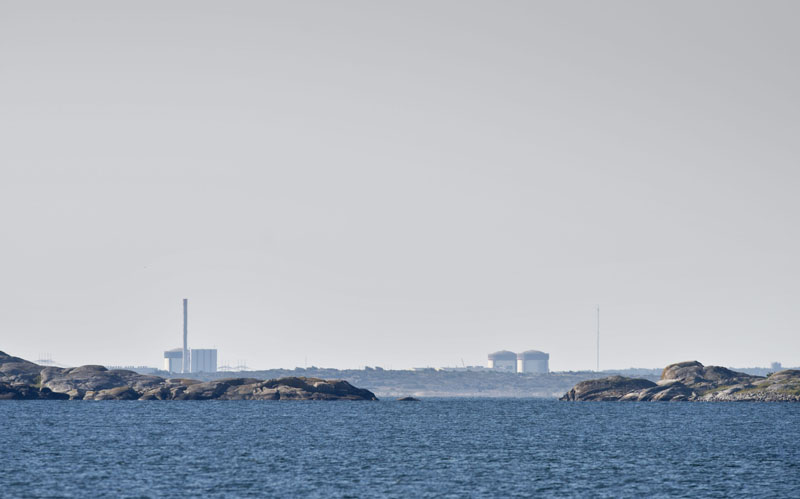 The Ringhals atomic power station near Varberg Sweden seen in the distant Thursday June 21, 2012 .Sweden on Thursday raised the security level for the country's nuclear power plants as police investigated suspected sabotage after explosives were found on a truck at the southwestern atomic power station Ringhals. Police said that bomb sniffer dogs detected the explosives during a routine check as security staff carried at an industrial area within the power plant's enclosure on Wednesday afternoon.