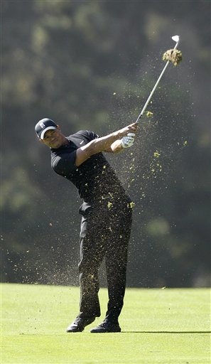 Tiger Woods hits a shot on the 14th hole during the second round of the U.S. Open Championship golf tournament Friday, June 15, 2012, at The Olympic Club in San Francisco. (AP Photo/Ben Margot)