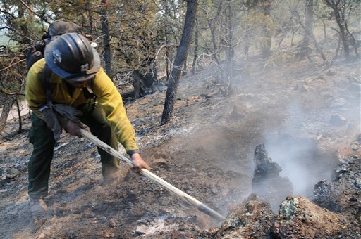 This photo provided by the U.S. Forest Service shows a hotshot during burnout operations at the Gila National Forest blaze on Friday.