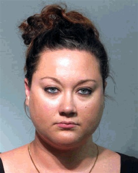 This photo released by the Seminole County Sheriff's Office shows Shellie Zimmerman, Tuesday, June 12, 2012. Zimmerman, the wife of the Trayvon Martin's shooter was charged with perjury Tuesday, accused of lying when she told a judge that the couple had limited funds during a hearing that resulted in her husband being released on $150,000 bond. She was released on $1,000 bond. (AP Photo/Seminole County Sheriff's Office)