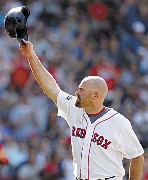 SEE YOU LATER: Boston’s Kevin Youkilis tips his helmet to the fans as he comes off the field after hitting a triple and being replaced with a pinch runner in the seventh inning against the Atlanta Braves on Sunday in Boston.