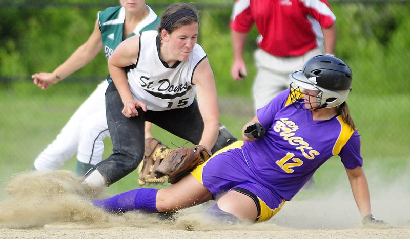 OUT: St. Dom’s second baseman Mary Caron tags out Buckfield’s Mindy Pye at third during the Senior High School All-Star Class C/D game Thursday evening at Cony Family Field in Augusta.