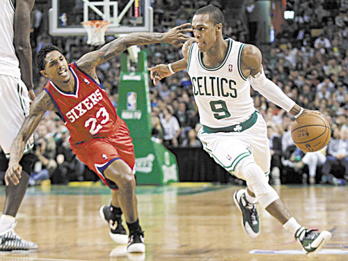 Boston’s Rajon Rondo (9) looks for an opening in a game against the Philadelphia 76ers. The Celtics will play exhibition games in October against two of Italy and Turkey's best teams.