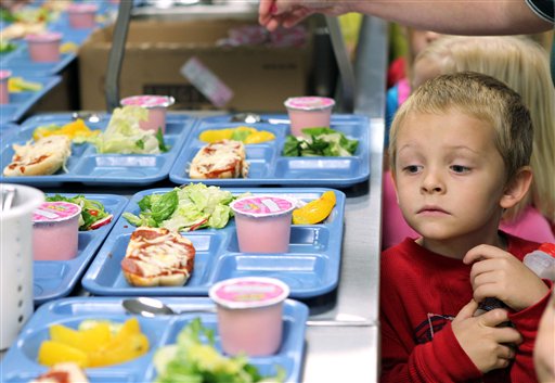 In this Tuesday, Nov. 1, 2011 file photo pre-K student Titus Bailey waitd in line for his lunch tray at West Hamlin Elementary School in West Hamlin, W. V. The nation�s school districts are turning up their noses at �pink slime,� the beef product that caused a public uproar earlier this year. The U.S. Department of Agriculture says the vast majority of states participating in its National School Lunch Program have opted to order ground beef that doesn�t contain the product known as lean finely textured beef. (AP Photo/The Herald-Dispatch, Lori Wolfe)