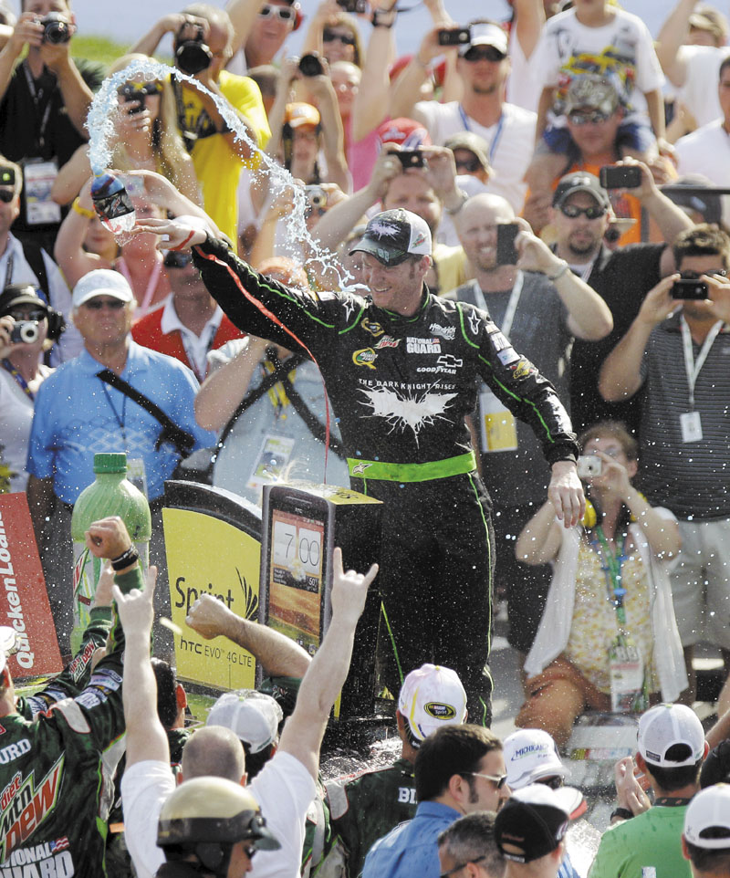 FINALLY: Dale Earnhardt Jr. celebrates in victory lane after winning the NASCAR Sprint Cup Series Quicken Loans 400 on Sunday at Michigan International Speedway.