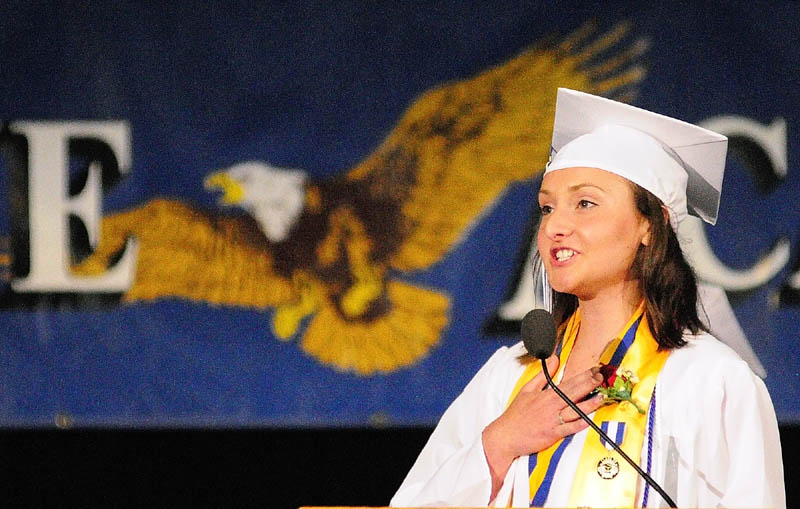 Class President Bethany Bernhardt leads the Pledge of Allegiance at the start of commencement on Friday night at the Augusta Civic Center.