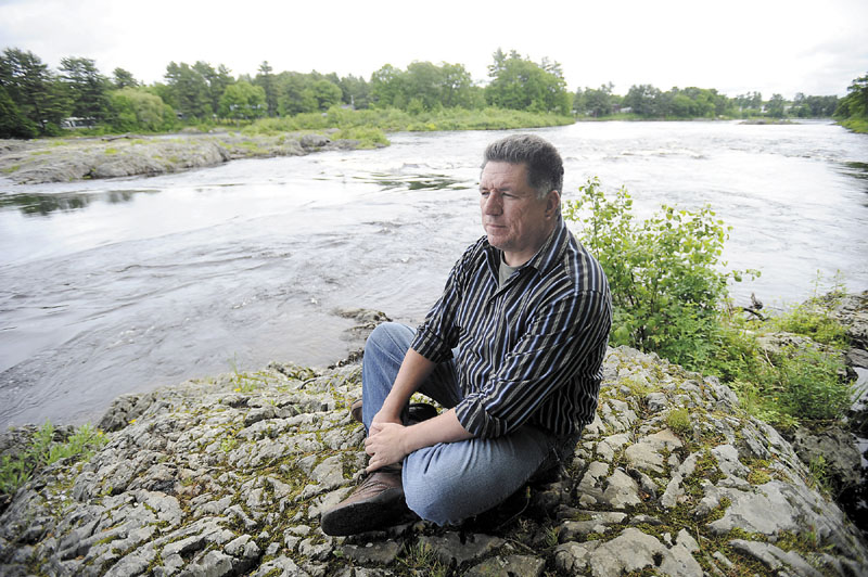 James Eric Francis Sr., a tribal historian with the Penobscot Nation, looks over the Penobscot River from land on Indian Island on Thursday. Francis said the removal of Great Works Dam is important for the Penobscot Nation and will help them regain their heritage.